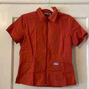 Scrub top. Perfect for healthcare worker. Two pockets. Good used condition.